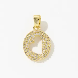 Macro detail of gold-plated heart pendant with pave-set sparkling cubic zirconia