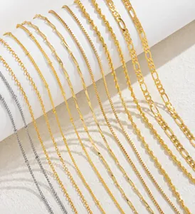 Detailed close-up of gold-plated necklaces with various link types on white rolls