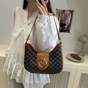 Sac sous le bras vintage en toile grise et cuir marron avec un logo M doré