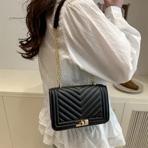 Fashionable black chevron quilted shoulder bag with gold chain strap and press lock closure