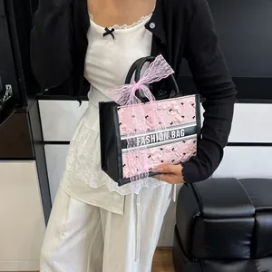 Pink quilted tote bag with silk scarf bow and black fashion band detail