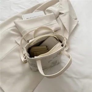 Floral print small bucket tote bag showing main compartment and zipper closure detail