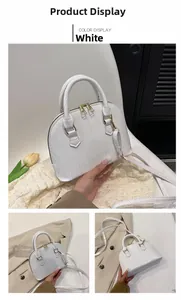 Detailed views of white crocodile pattern shell bag with gold hardware and dual zippers
