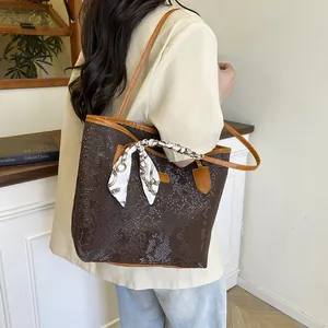 Brown faux crocodile tote bag with silk scarf detail and large capacity shoulder strap
