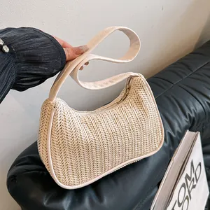 Chic beige woven hobo shoulder bag with crescent shape and smooth strap detail