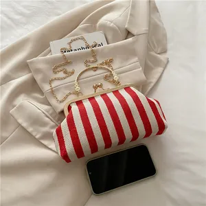 Vintage red and white striped frame bag with golden chain strap and carved handle
