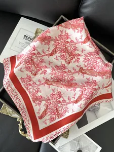 Close-up of elegant bird and fruit floral pattern on silk-feel square scarf