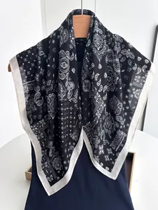 Detail of black and white paisley cotton linen square scarf with premium smooth edges