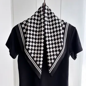 Elegant black and white checkerboard silk scarf with striped border for spring fashion