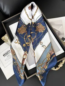 Detail of vintage equestrian square scarf featuring navy chain pattern and silky texture