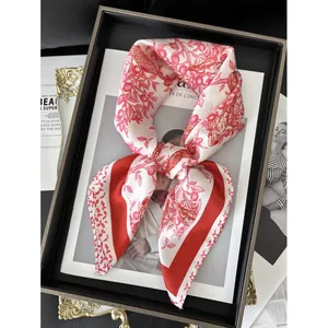 Elegant red and ivory floral silk scarf with bird pattern in stylish black frame