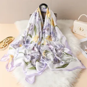Detailed view of silk-like floral scarf featuring purple tulips on plush texture background