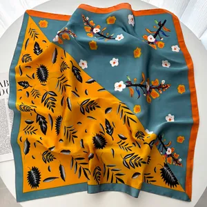 Elegant 70cm square silk scarf with yellow and blue floral patterns and orange edges
