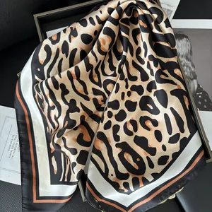 Elegant leopard print square silk scarf with black border and stylish brown tones