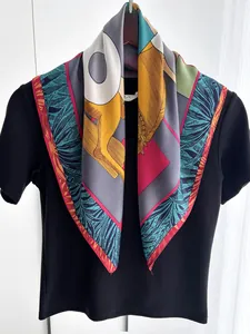 Detail of silk scarf with colorful tropical leaf patterns and artistic geometric shapes