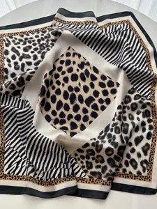 Detailed close-up showing the leopard and zebra print patterns on this large square silk scarf