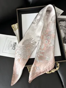 Detail of pink floral silk scarf with gradient chrysanthemum pattern on props