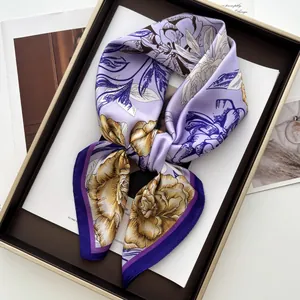 Close-up of elegant lavender silk scarf with yellow peony print and purple edges