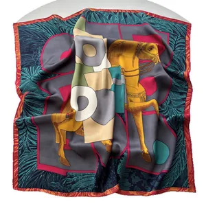 Elegant silk scarf featuring horse and letter patterns on a grey satin background