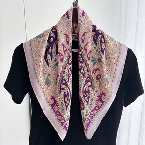 Detailed macro of paisley pattern silk scarf with purple and pink floral prints