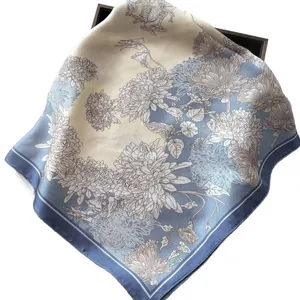 Elegant floral silk square scarf in beige and blue featuring detailed chrysanthemum patterns