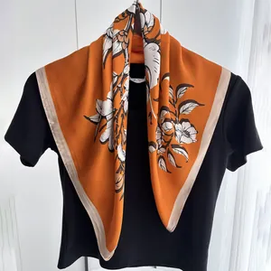 Caramel silk scarf with white floral print and beige edges for elegant women