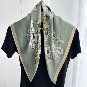 Elegant mint green silk scarf with large magnolia floral print and beige borders