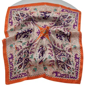 70cm faux silk square scarf featuring vibrant orange paisley print and ethnic floral motifs