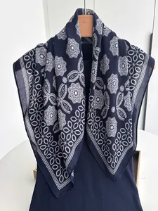 Detailed view of dark blue cotton linen scarf with white floral mandala print textures
