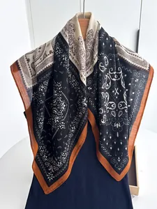 Detailed view of paisley silk square scarf with elegant retro pattern and smooth texture
