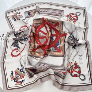 Detail of nautical square scarf with red helm and anchor print on premium silk texture
