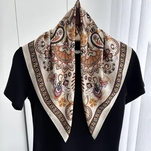 Close-up of vintage paisley printed silk scarf draped over a classic black shirt