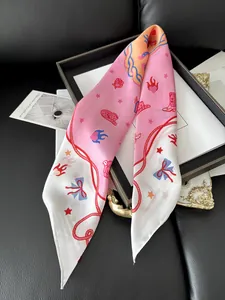 Detailed macro of floral silk scarf featuring vintage cowboy boots and stars patterns