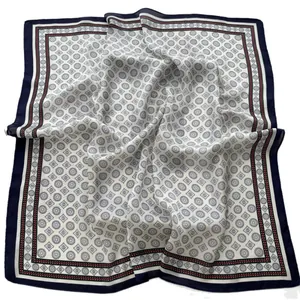 Classic square silk scarf with geometric prints and navy blue border on white fabric