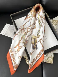 Detail of luxury silk scarf with French carriage print and elegant equestrian patterns