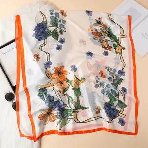Elegant floral silk satin scarf with orange borders and purple hydrangea print