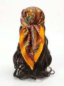 Detailed view of the paisley pattern and silk texture on the vintage yellow headscarf