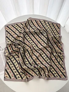 Macro detail of silk texture square scarf featuring vintage equestrian horse pattern