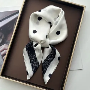 Elegant silk-like scarf featuring modern black polka dots and striped pattern accents