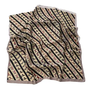 Equestrian pattern silk scarf with horse motifs and black stripes on gold base