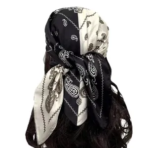 Two-tone paisley silk-like headscarf with satin finish shown on a model from the back