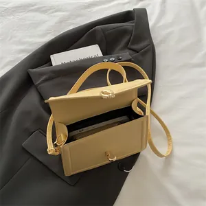 Fashionable pale yellow square PU leather handbag with metal turn-lock and adjustable strap