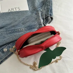 Cute red apple shaped crossbody bag with gold chain strap and green leaf detail