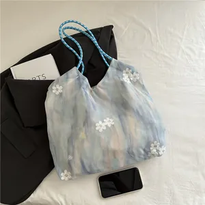 Gradient floral embroidered bucket bag with woven rope handles for summer commuting style
