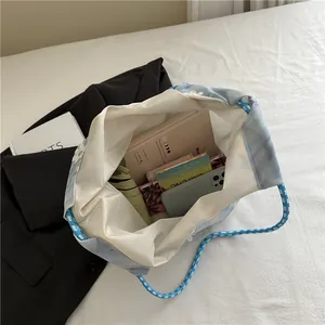 Spacious gradient canvas bucket tote with floral embroidery and rope handles