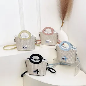 Lace-trimmed straw tote bag in four pastel colors with adjustable shoulder straps