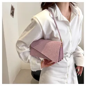 Pink rhinestone shoulder bag detail showing triple-layered accordion structure and sparkle