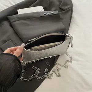 Silver crocodile texture chain bag showing spacious interior for a smartphone