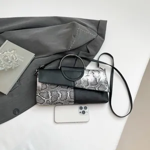 Chic snakeskin patchwork envelope bag with silver handle and crossbody strap for women