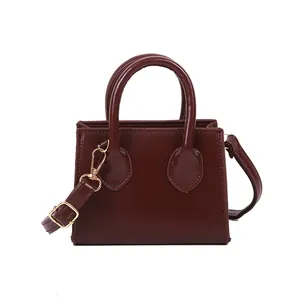 Classic burgundy PU leather mini square tote bag with gold hardware and shoulder strap
